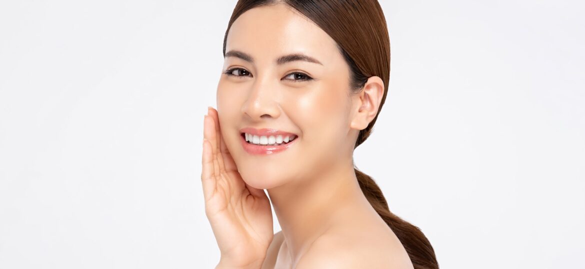 asian-woman-smiling-with-hand-touching-face-beauty-skin-care-concepts